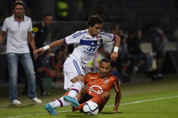 Lyon's Brazilian defender Rafael (L) vies with Lorient's French Algerian midfielder Walid Mesloub during the French L1 football match between Olympique Lyonnais and FC Lorient at the Gerland stadium in Lyon, eastern France on August 9, 2015. AFP PHOTO / PHILIPPE DESMAZES