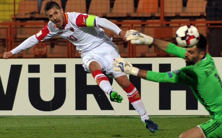 Montenegro's Stevan Jovetic strikes the ball during the WC 2018 football qualification match between Armenia and Montenegro in Yerevan on November 11, 2016. / AFP PHOTO / Karen MINASYAN